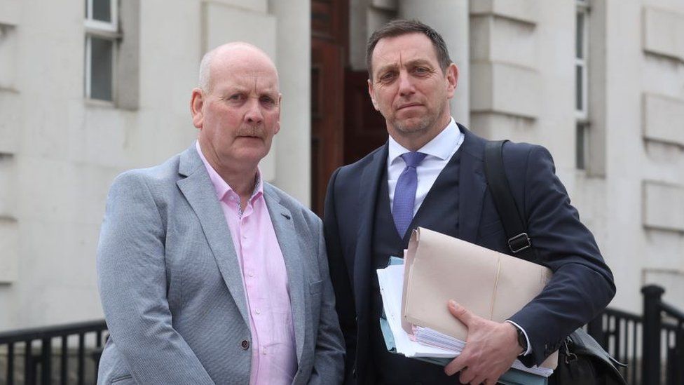 Patrick Thompson is pictured outside the High Court in Belfast with his solicitor Pádraig Ó Muirigh.