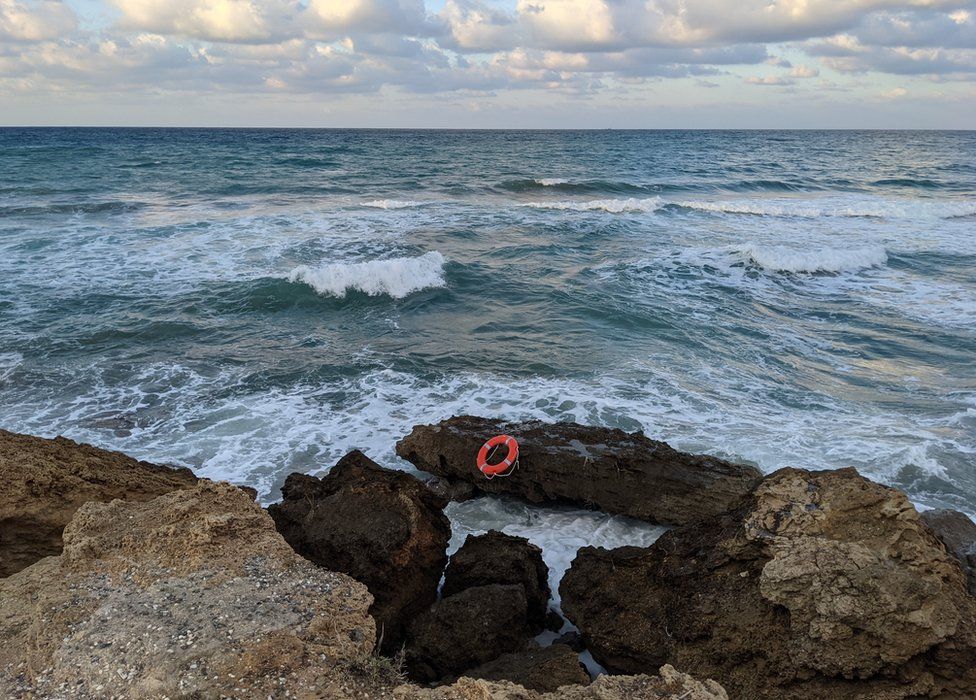 Life ring on rocks