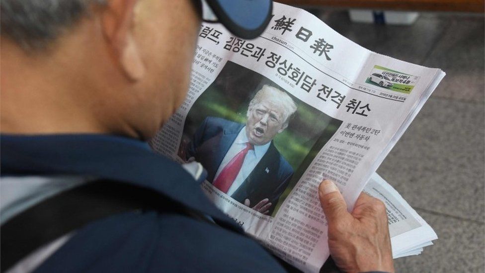 South Korea man reads a newspaper