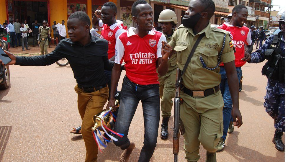 Arsenal fans arrested Uganda celebrating Manchester victory - BBC News