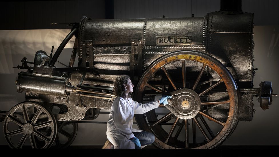 Lead Conservator Wendy Somerville-Woodiwis unveils Stephenson's Rocket at its new home, the National Railway Museum in York in September