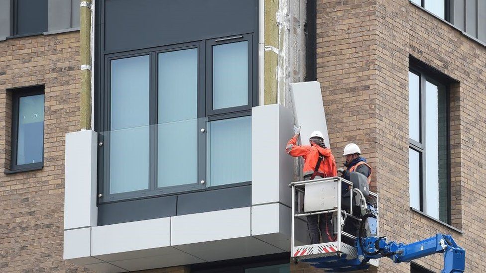 Cladding being removed from building in Manchester in 2017