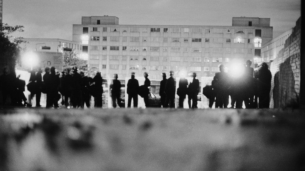 Police officers in riot gear on the Broadwater Farm housing estate