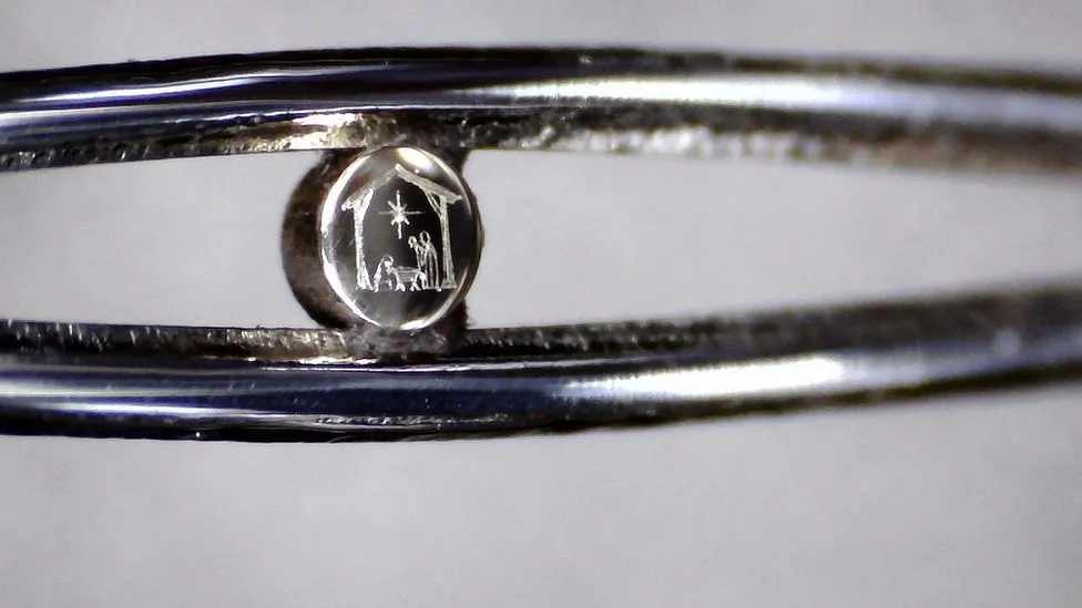 Tiny Nativity scene in the eye of a needle on display in Birmingham