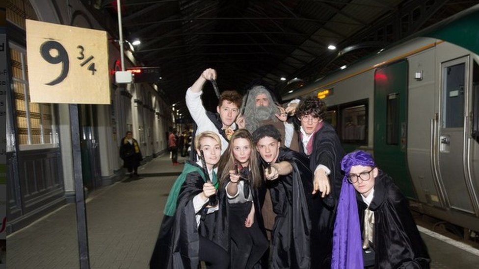 Students board Hogwarts Express at Platform 9¾