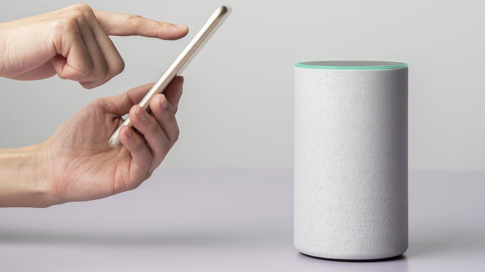 Picture of a phone and a smart speaker