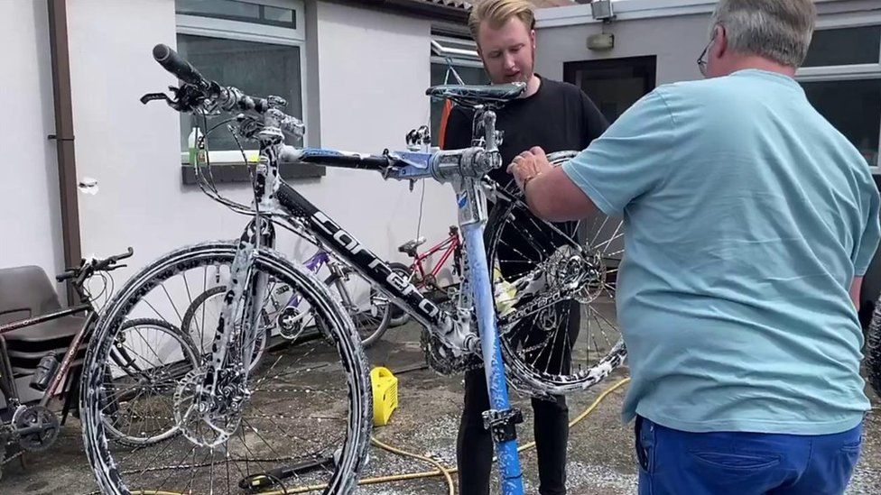 Kinnon family fixing bike