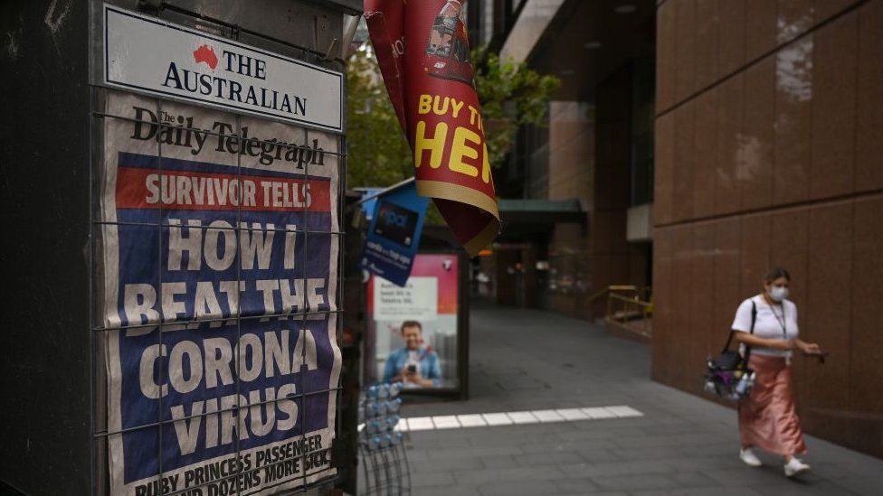 A kiosk displaying the front pages of The Daily Telegraph newspaper in Sydney