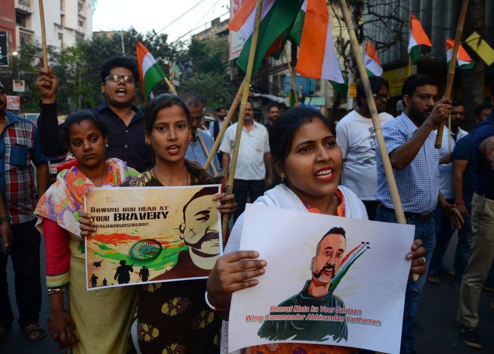 People holding posters of Wing Commander Abhinandan Varthaman celebrate his return at a rally in Kolkata on 2 March 2019.