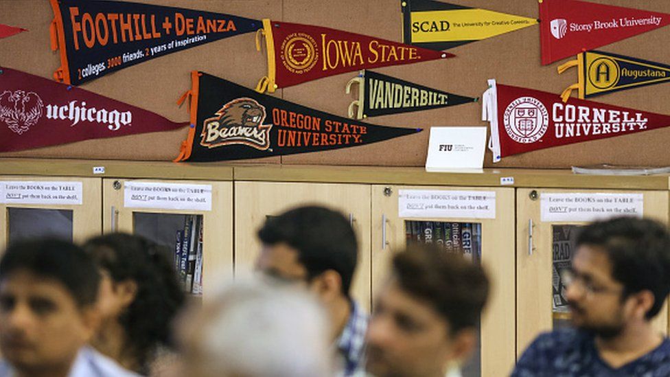 Banners of U.S. universities are displayed in a classroom as participants attend a counselling session given by the University of Southern California (USC) at the United States-India Education Foundation