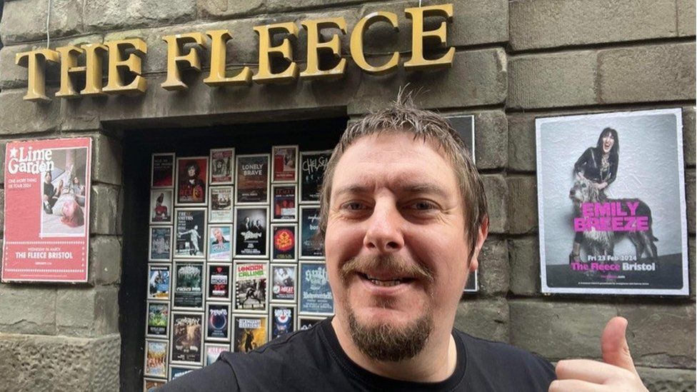 Selfie of Matt Pugh outside the Fleece next to its signage