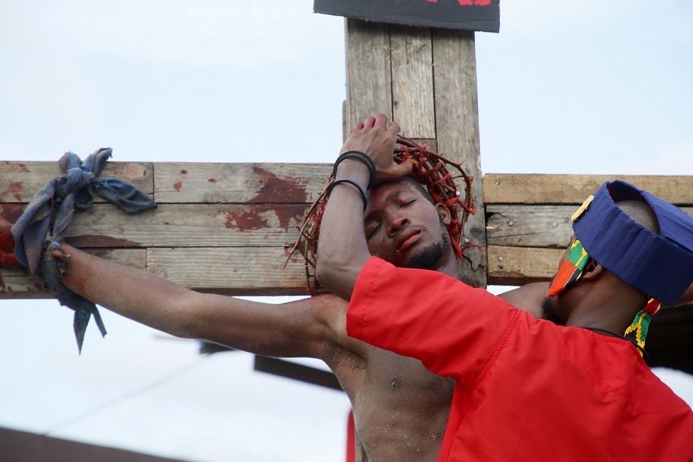 A man performs as Jesus Christ during a procession marking the Good Friday in Abidjan, Ivory Coast.