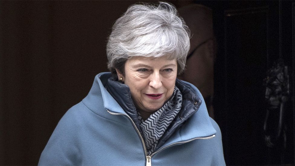 Theresa May leaves 10 Downing Street on 26 March