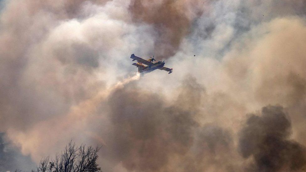 Aircraft flying through plumes of smoke