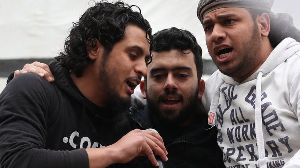 Abdel Basset al-Sarout (left) sings during a rally in Idlib province. Photo: 15 March 2019