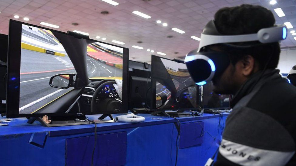 An Indian visitor plays video games during the 'India Gaming Show' exhibition in New Delhi on February 4, 2019