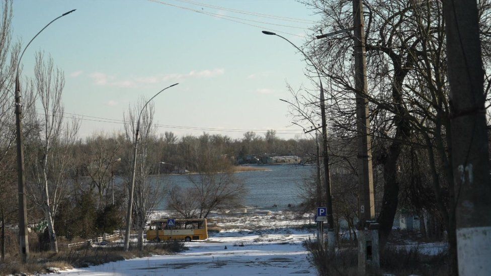 The Dnipro river, seen down a street in Kherson