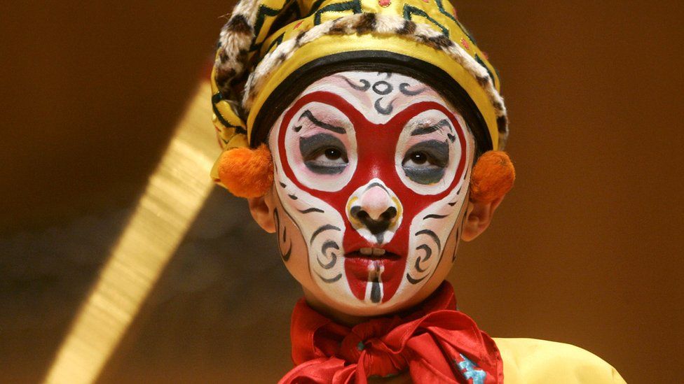 A young student performs as 'Monkey God' at the Peking Opera in Beijing