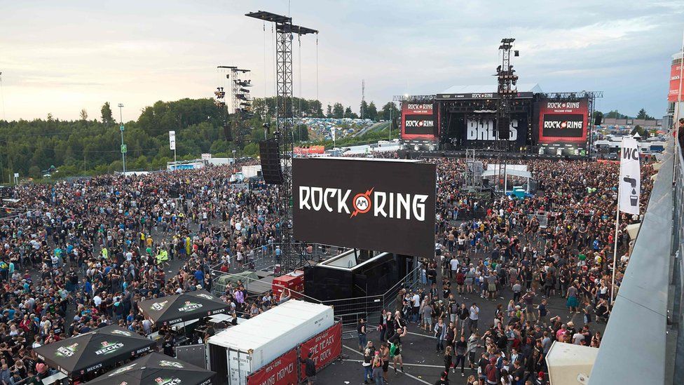 Festival-goers leave the venue of the Rock am Ring music festival in Nuerburg, 2 June