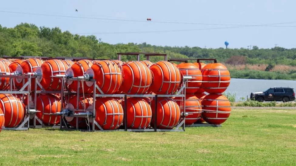 Justice department sues Texas over floating barrier in Rio Grande river