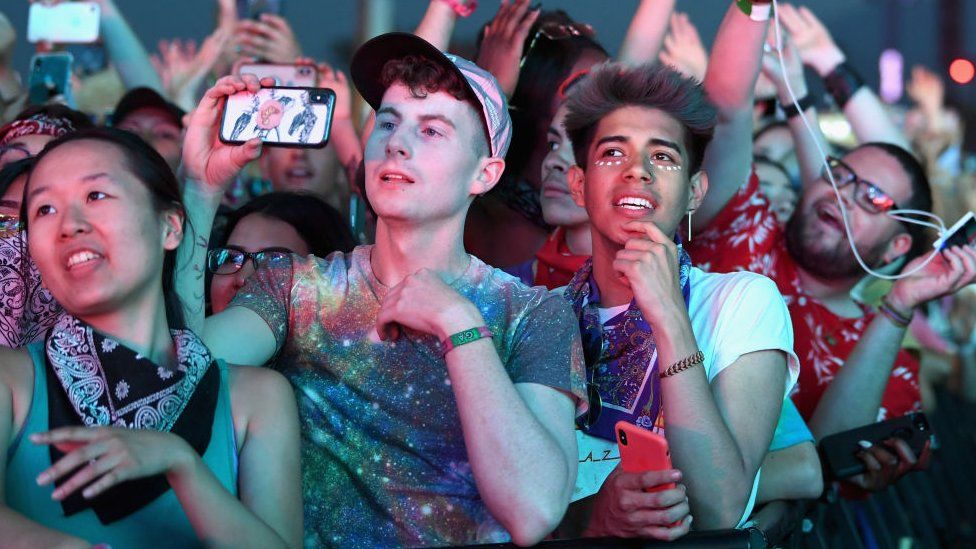 Festivalgoers watch Zedd perform at Coachella Stage during the 2019