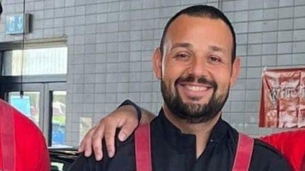 Man with short hair and beard in firefighter dress