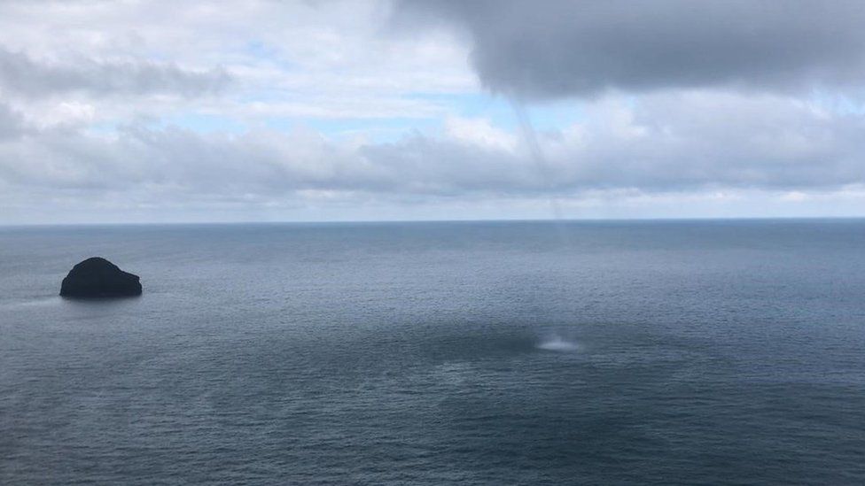 The waterspout next to Gull Rock off the Trebarwith Strand beach