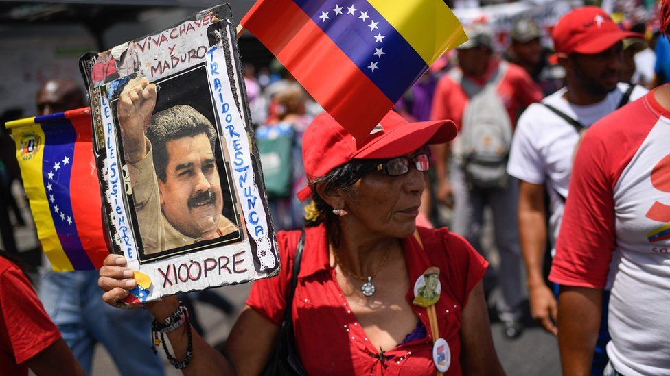 Government supporters attend a rally in the surroundings of Miraflores Presidential Palace in Caracas
