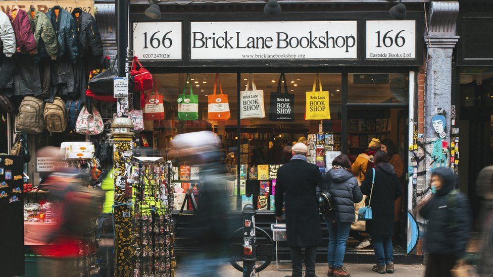 Shoppers and pedestrians outside the Brick Lane Bookshop