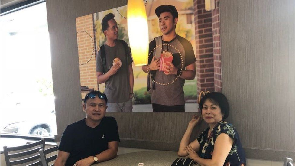 Jevh's parents pose with the photo