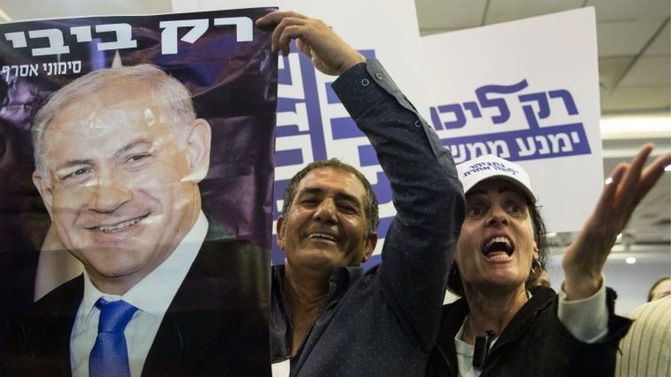 Likud Party supporters react to Israeli Prime Minister Benjamin Netanyahu's speech on 4 March 2019 in Tel Aviv, Israel.