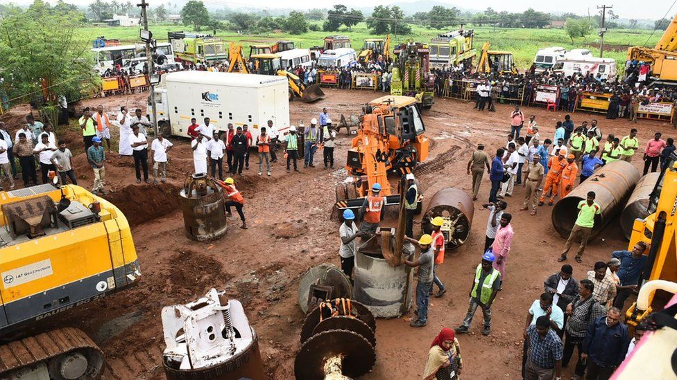 Workers digging a second well
