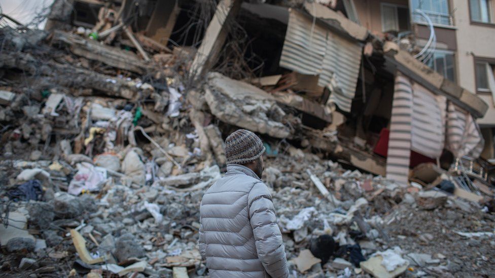 A antheral   walks past   a destroyed gathering  successful  adjacent   Hatay metropolis  pursuing  the deadly earthquake