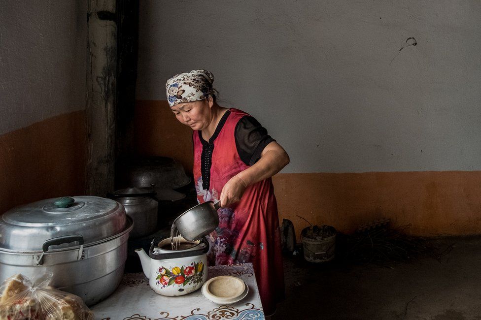 Gulzira Auelkhan makes tea at home in her village. She was detained for 18 months