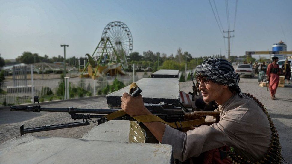 Afghan security forces and militia guard against Taliban attacks in Herat