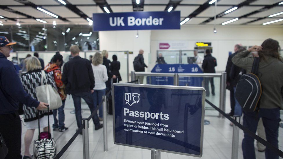 Border Force check passports at Gatwick Airport