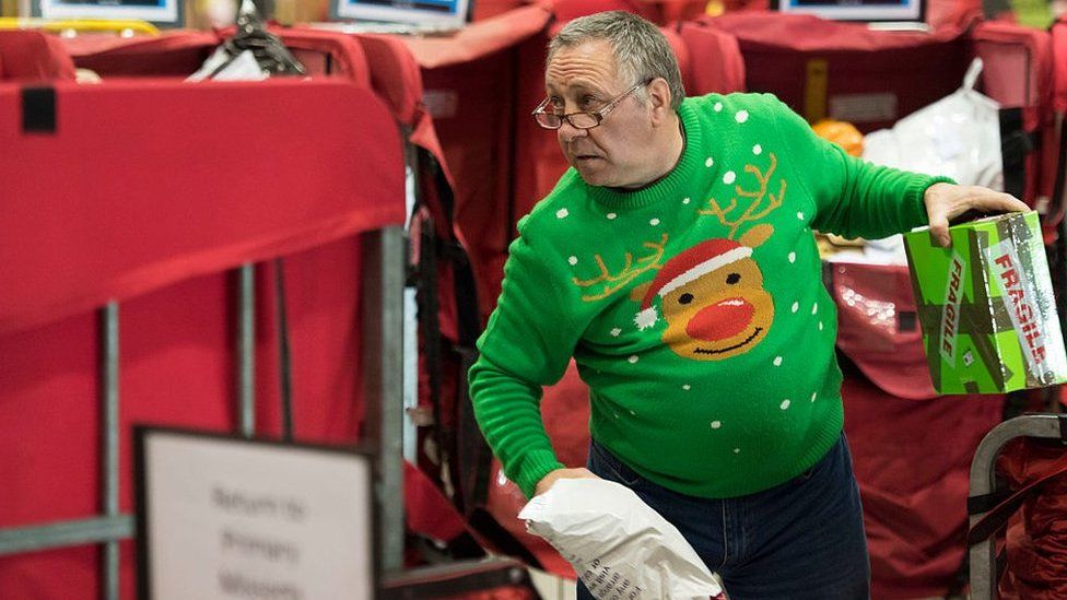 Royal Mail worker in a Christmas jumper