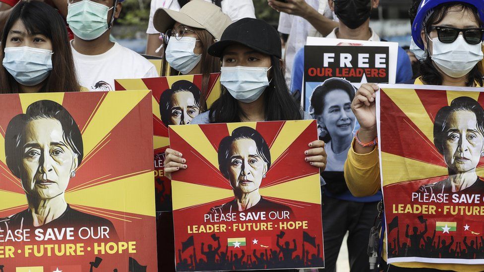 Protesters hold placards calling for the release of detained Myanmar State Counselor Aung San Suu Kyi