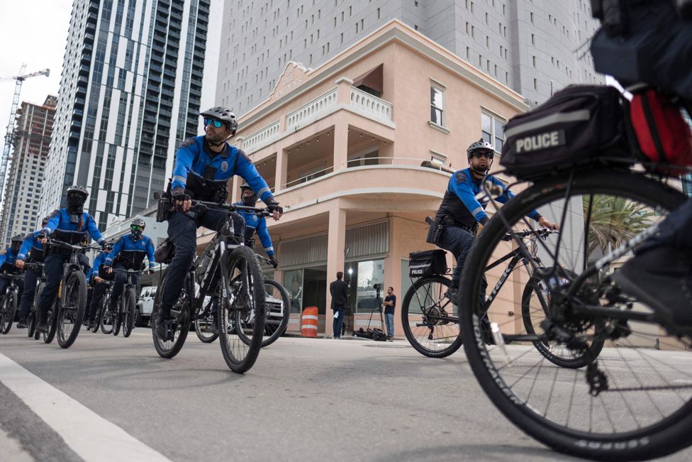 Miami Police Officers ride around the Wilkie D. Ferguson Jr. United States Federal Courthouse in Miami, Florida, on June 13, 2023