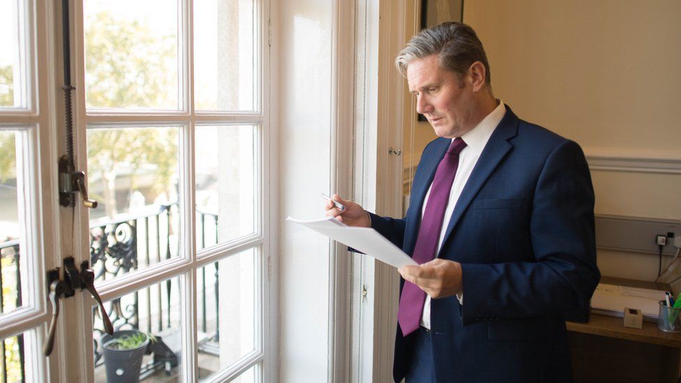 Sir Keir Starmer reads his conference speech