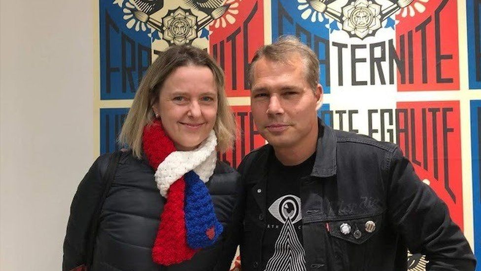 Theresa Cede with Shepard Fairey in front of his artwork Liberté, Egalité, Fraternité as an homage to all the victims of the November 13 attacks