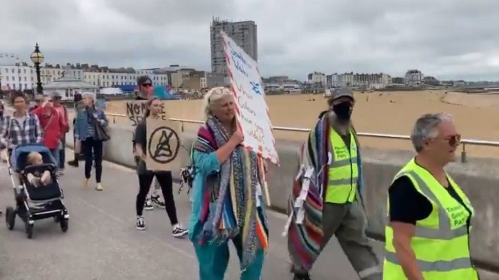 Protestors marching along Margate seafront