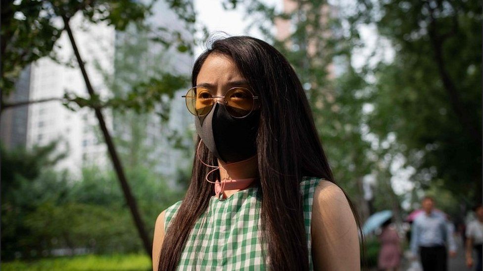 Woman with protective face mask in Beijing