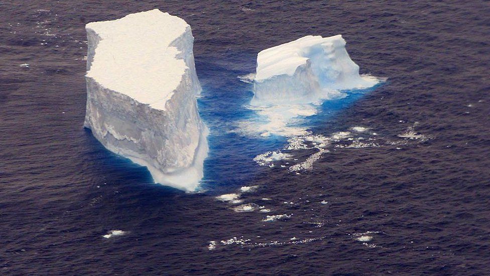 An iceberg floating in the ocean