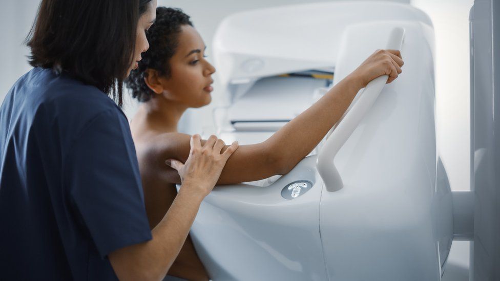 Nurse with diligent  making mammogram