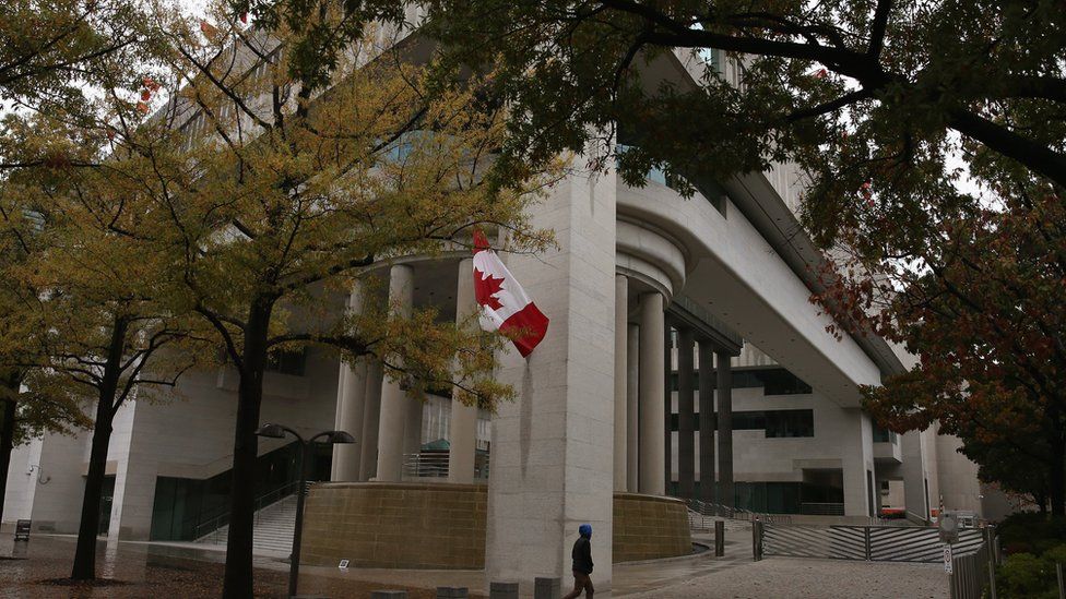 A man walks past the Canadian Embassy in Washington, DC.