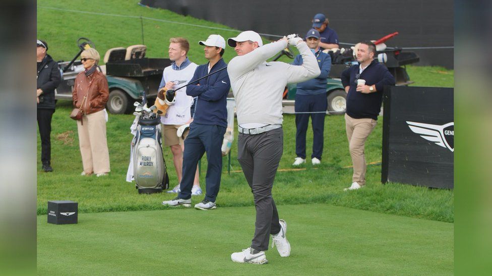 Charlie Cooley on the golf course with Rory McIlroy