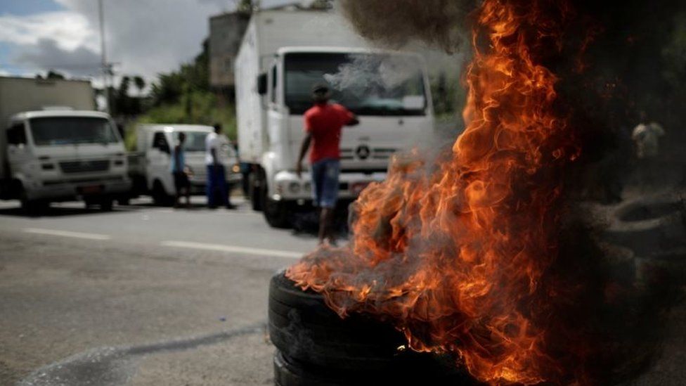 Tyres burn as truck owners block the BR-324 highway during a protest against high diesel prices in Simoes Filho near Salvador, Brazil May 23, 2018.