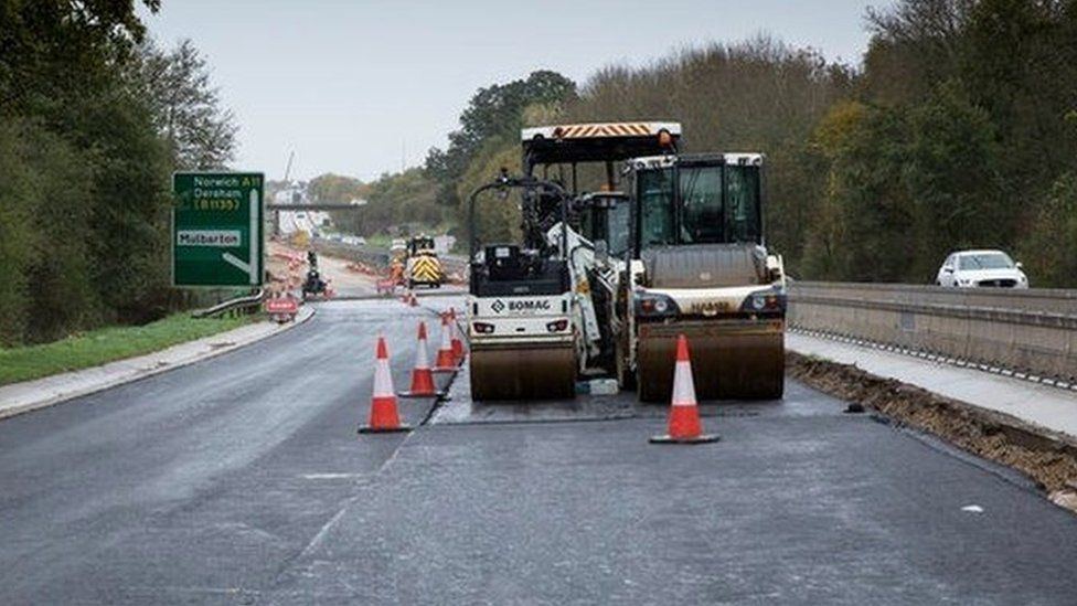 Heavy machinery on newly-resurfaced A11