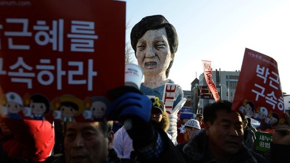 Protesters march against South Korean President Park Geun-Hye on 10 December in Seoul